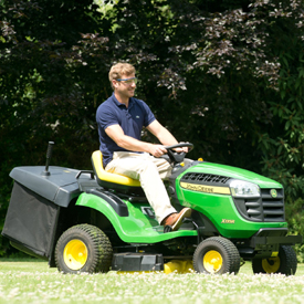 X146R Tractor mowing lawn