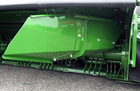 Windrow forming shields (rear curtain raised for visibility)